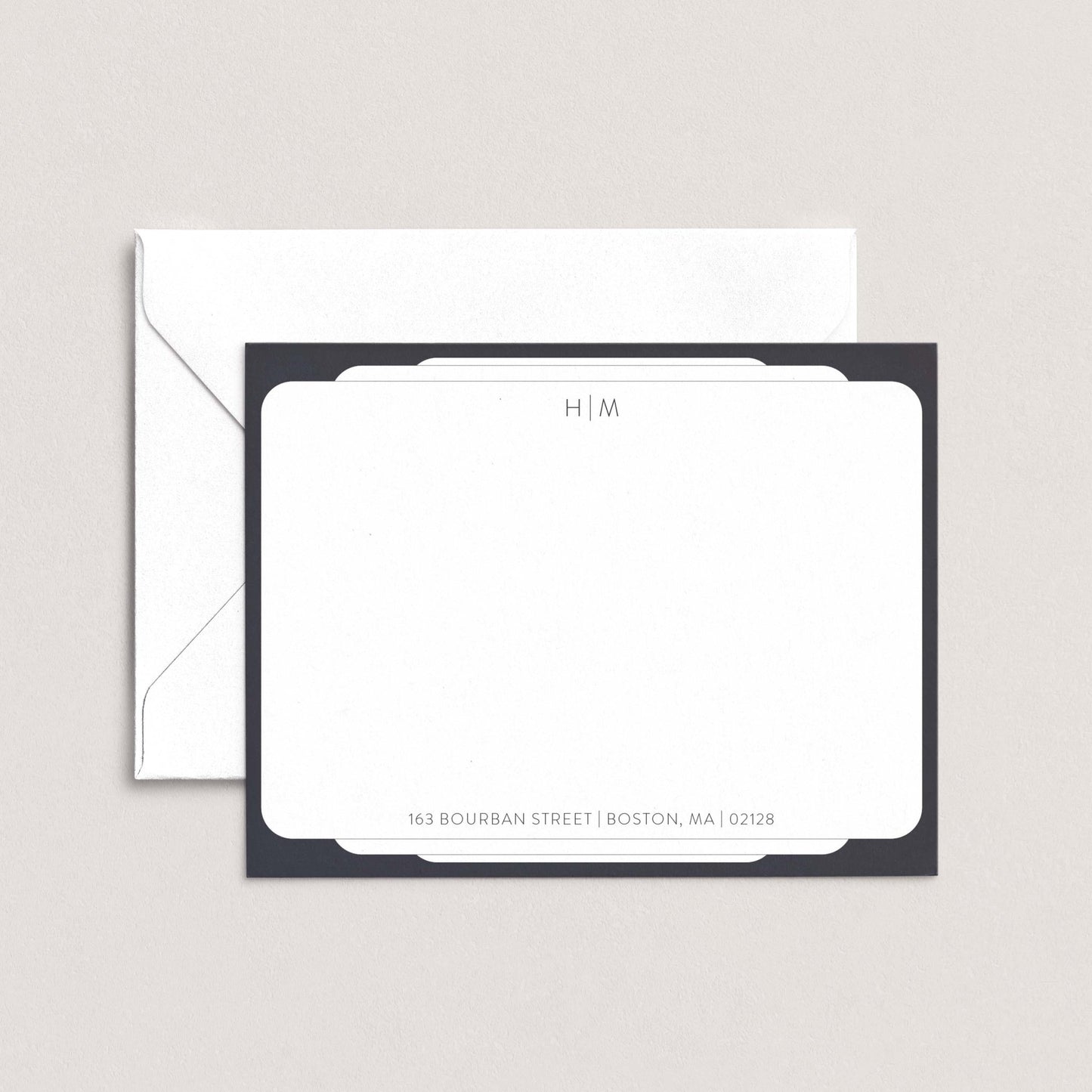 a white envelope with a black border, placed on top of a white background.
