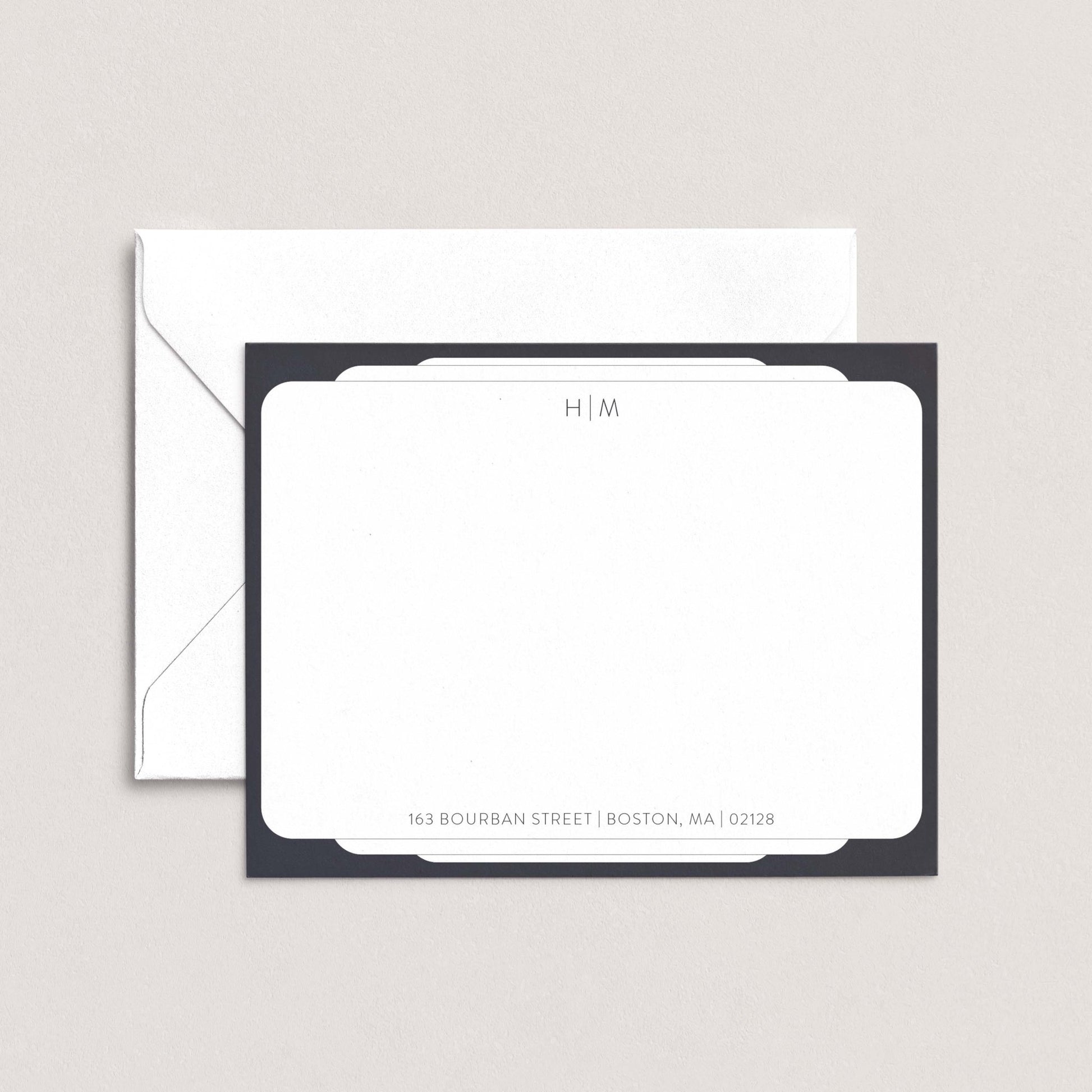 a white envelope with a black border, placed on top of a white background.