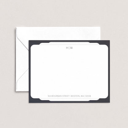 a white envelope with a black border, placed on top of a white background.