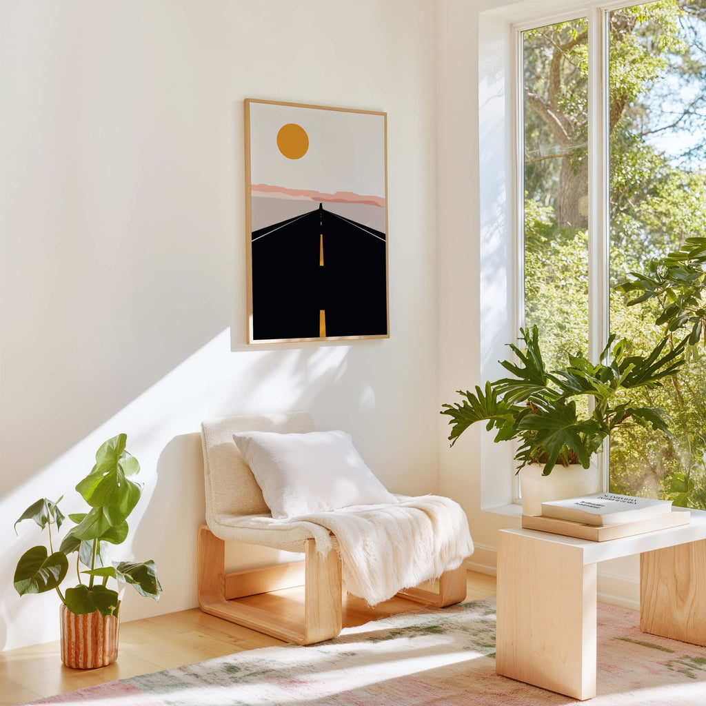 Road trip art print displayed in a bright room with plants and natural light.