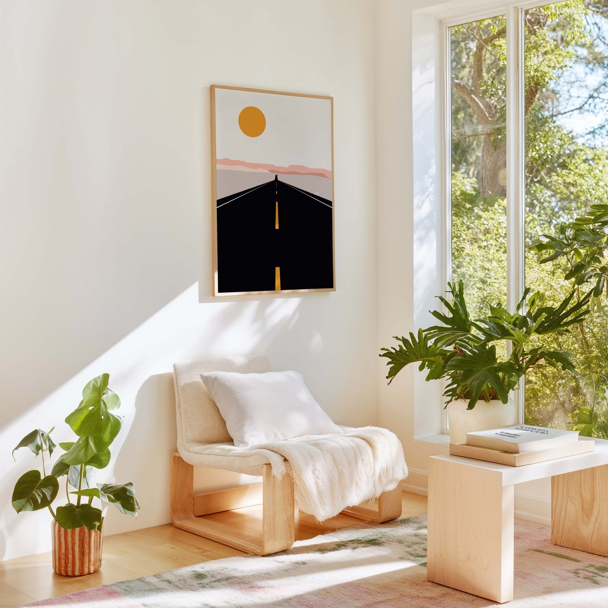 Road trip art print displayed in a bright room with plants and natural light.
