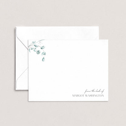 A white envelope with a floral design on the left side and a personalized message on the right side.
