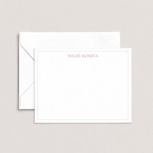 A white envelope with a blank card inside, both placed against a light background.