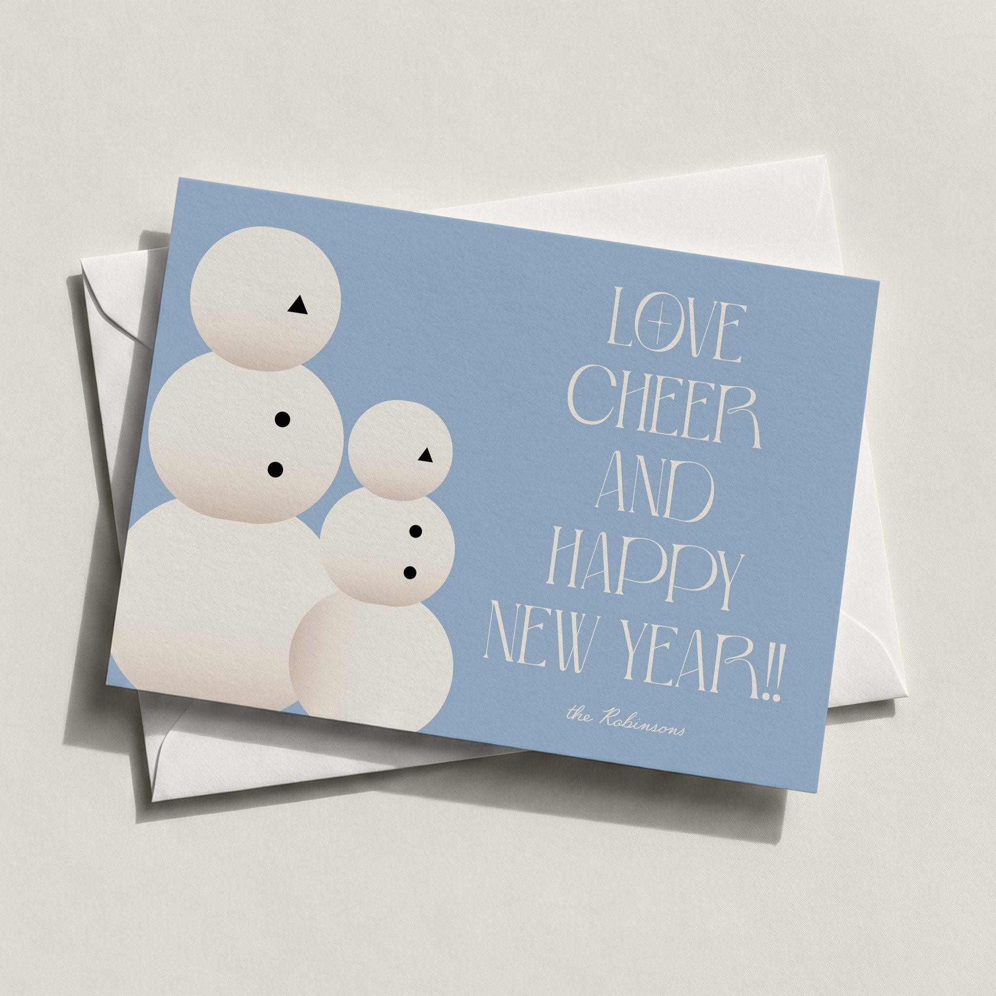 Snow People holiday card in dusty blue with illustrated snowmen and LOVE CHEERS AND HAPPY NEW YEAR