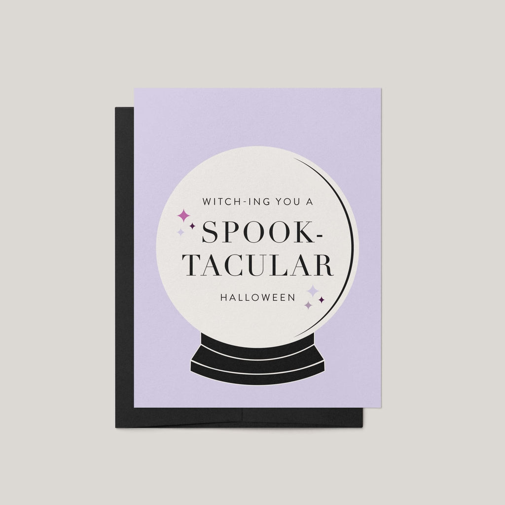Spooktacular Halloween greeting card by Blú Rose, lavender card with crystal ball illustration and witch-ing you a spooktacular Halloween text, shown with black envelope
