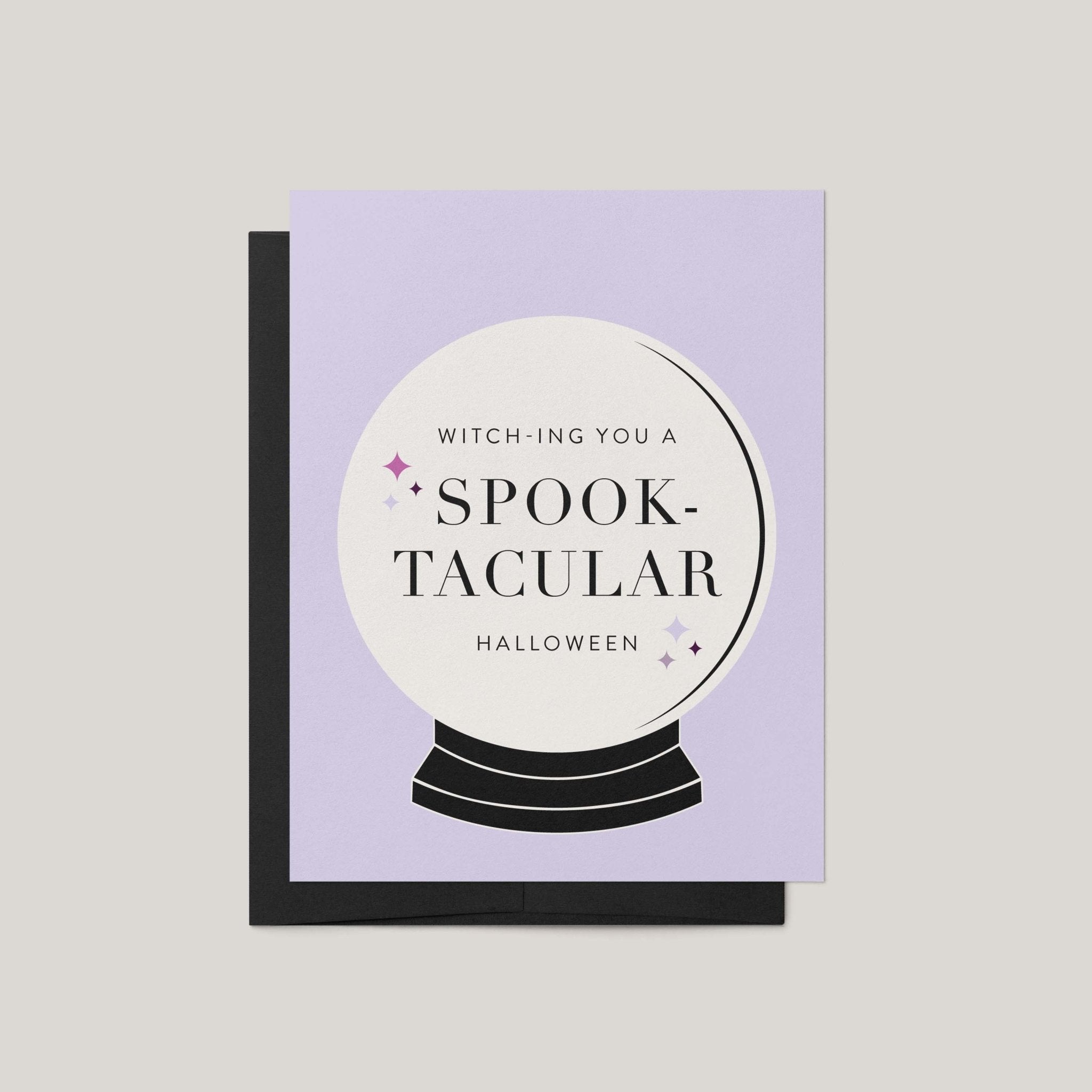 Spooktacular Halloween greeting card by Blú Rose, lavender card with crystal ball illustration and witch-ing you a spooktacular Halloween text, shown with black envelope