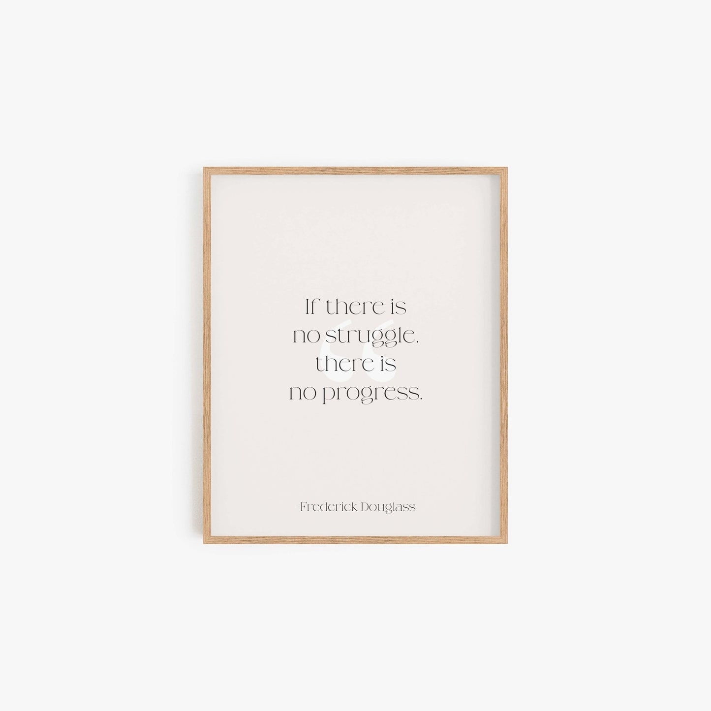 Minimalist framed Frederick Douglass quote print in neutral tones on white wall