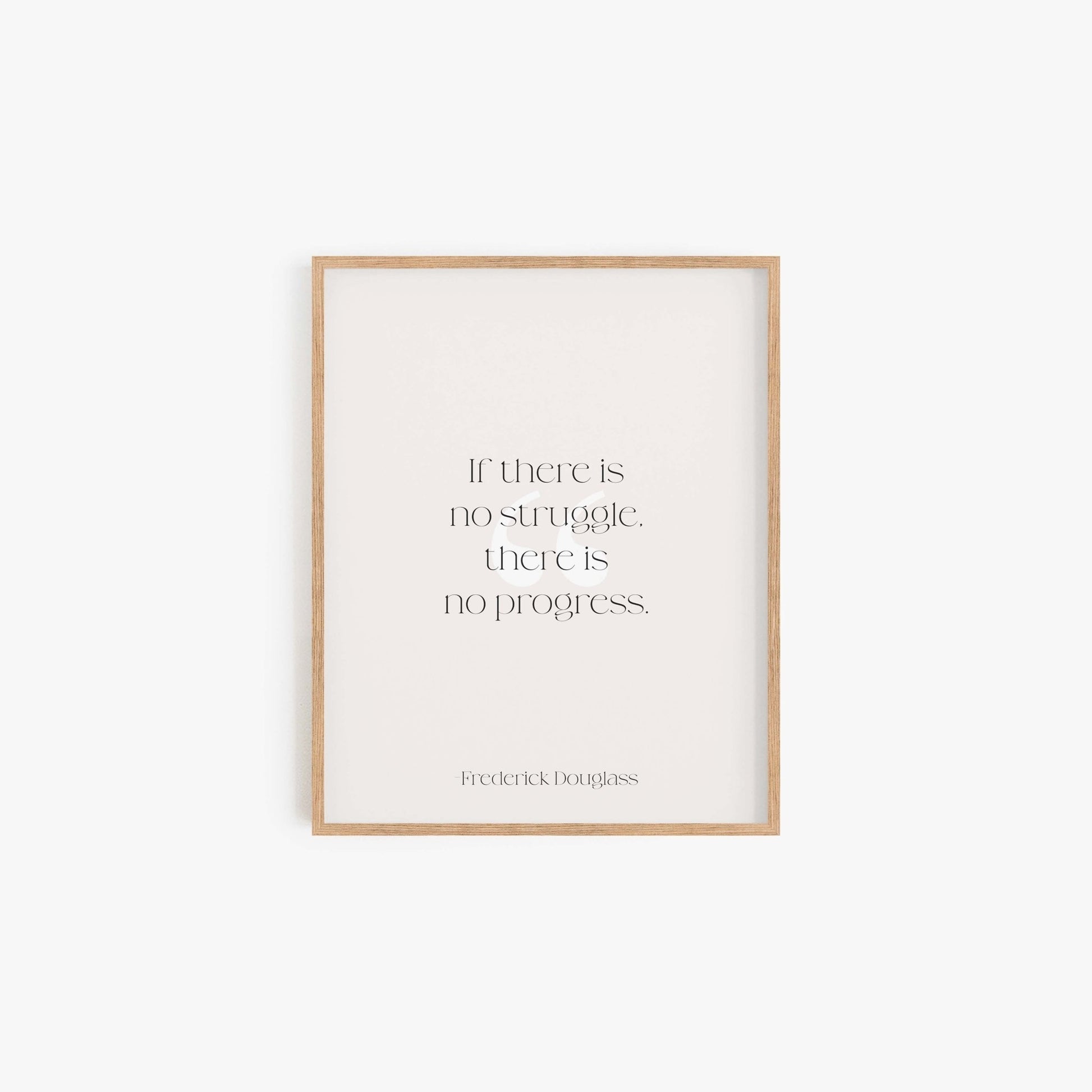 Minimalist framed Frederick Douglass quote print in neutral tones on white wall