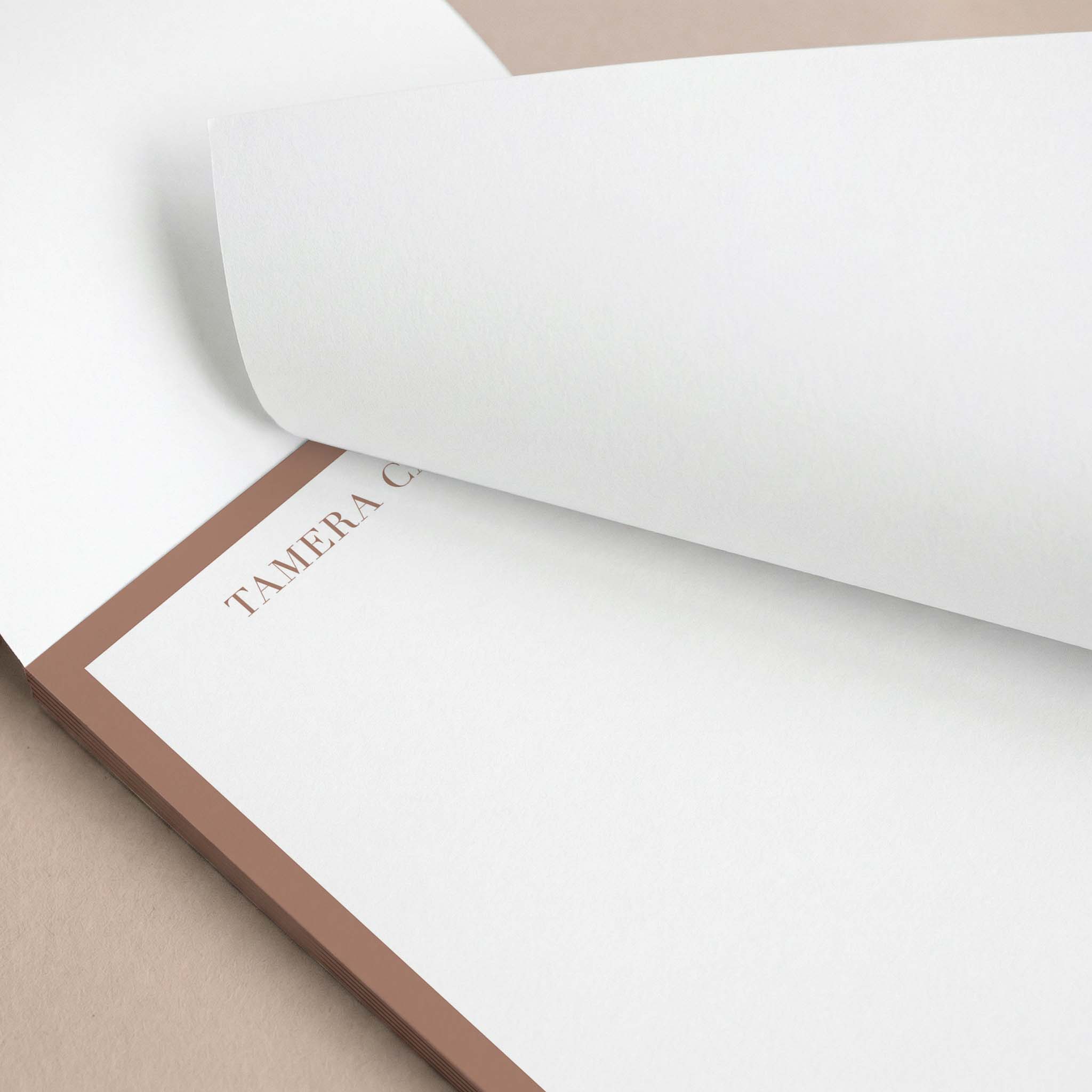 Tamera Border personalized notepad by Blú Rose, close-up of the brown border with the top sheet lifted