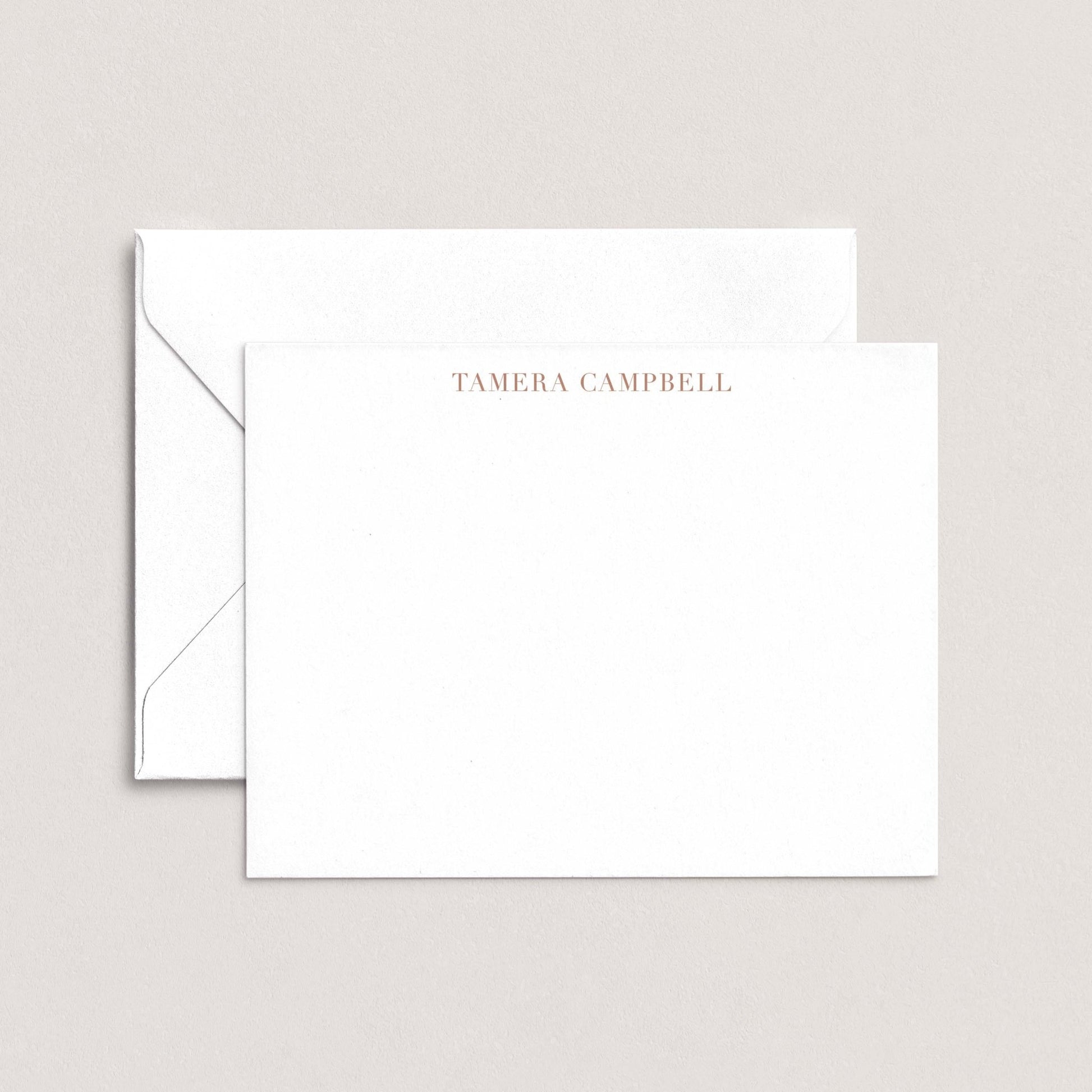 A white envelope with the name 'TAMERA Campbell' printed on it, placed on top of a plain white background.