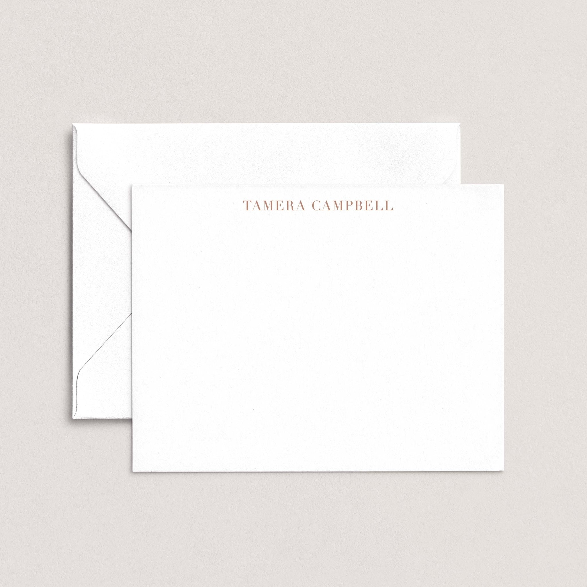 Tamera personalized notecards by Blú Rose, white flat notecard with the name 'Tamera Campbell' in taupe, shown with a coordinating white envelope