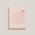 Tequila, Unicorns & Rainbows birthday card by Blú Rose, blush pink card with a pastel rainbow and 'have a magical birthday' message, shown with a kraft envelope