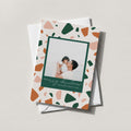 Terrazzo photo card with a green, rust and cream terrazzo border framing a family photo