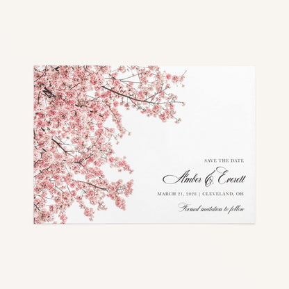 Close-up of The Cherry Blossom Save the Date design highlighting cascading pink cherry blossom branches and black script typography