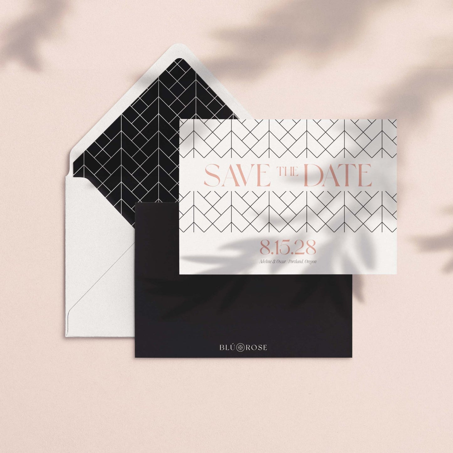 Envelope with The Lattice geometric pattern envelope liner shown with save the date card on a blush background