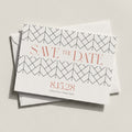 The Lattice Save the Date card by Blú Rose displayed at an angle stacked on a white envelope against a neutral background