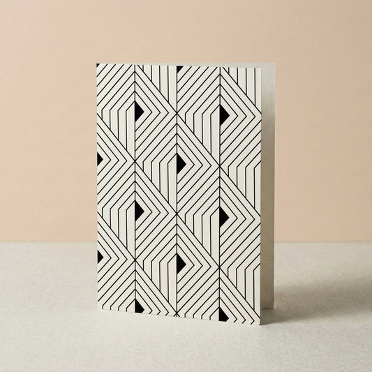 The Prism Greeting Card by Blú Rose standing upright on a blush and neutral background showing the full geometric pattern design