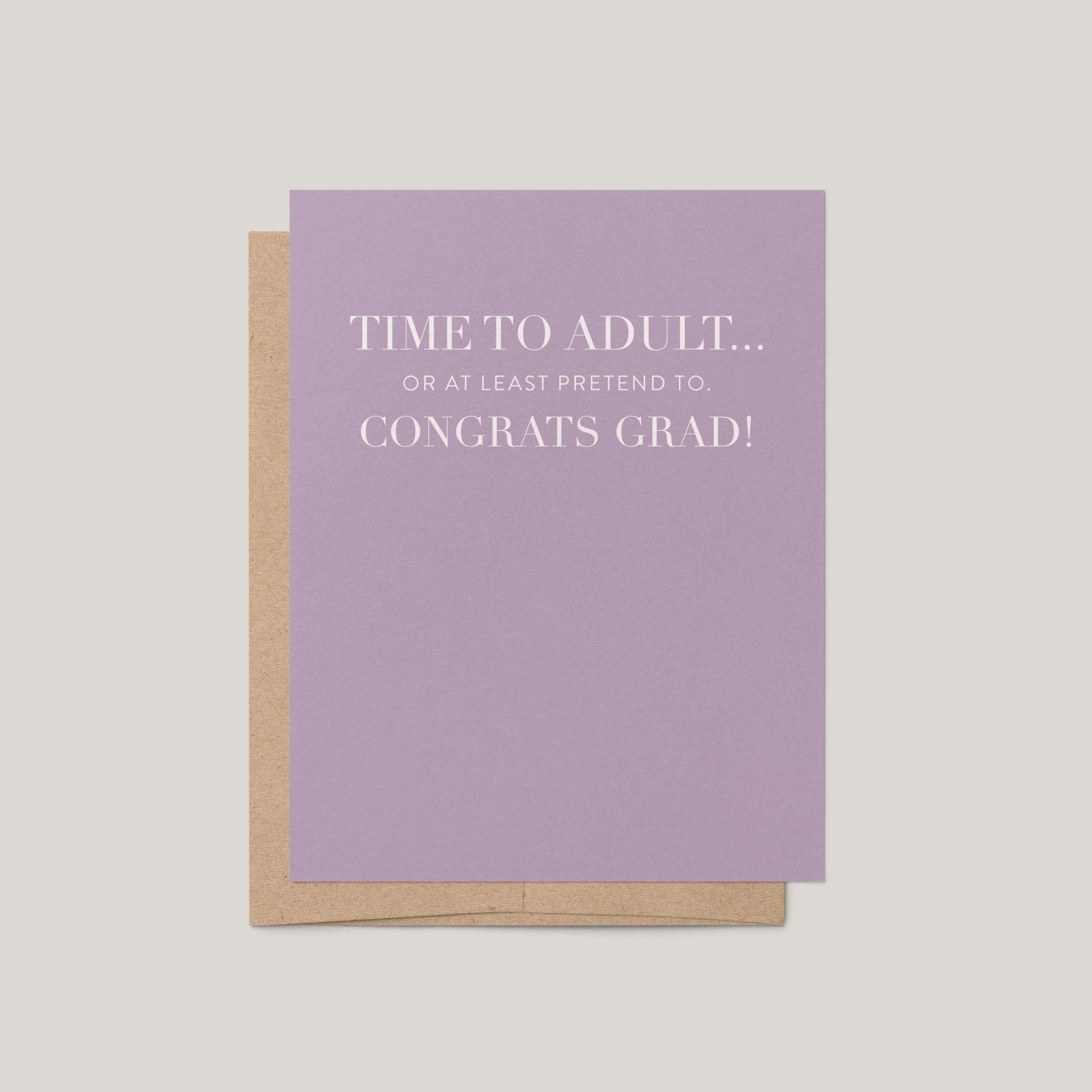 Time to Adult funny graduation greeting card by Blú Rose, lavender card with white serif congrats grad text, shown with kraft envelope