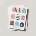 Ugly Sweater holiday card with a grid of illustrated knit sweaters and cozy vibes & holiday cheer