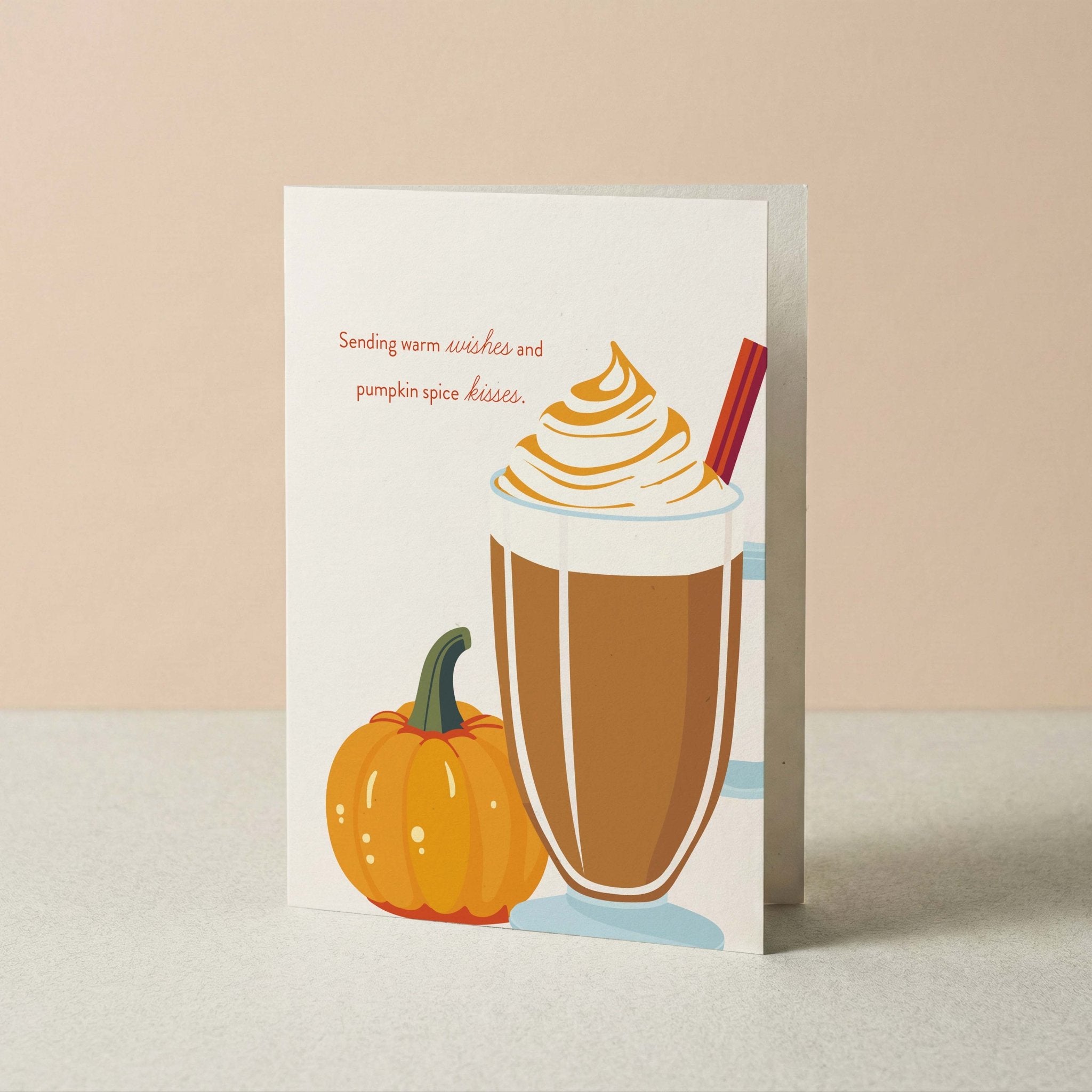 Warm Wishes & Pumpkin Spice Kisses autumn card by Blú Rose standing upright, illustrated latte and pumpkin design on a neutral background