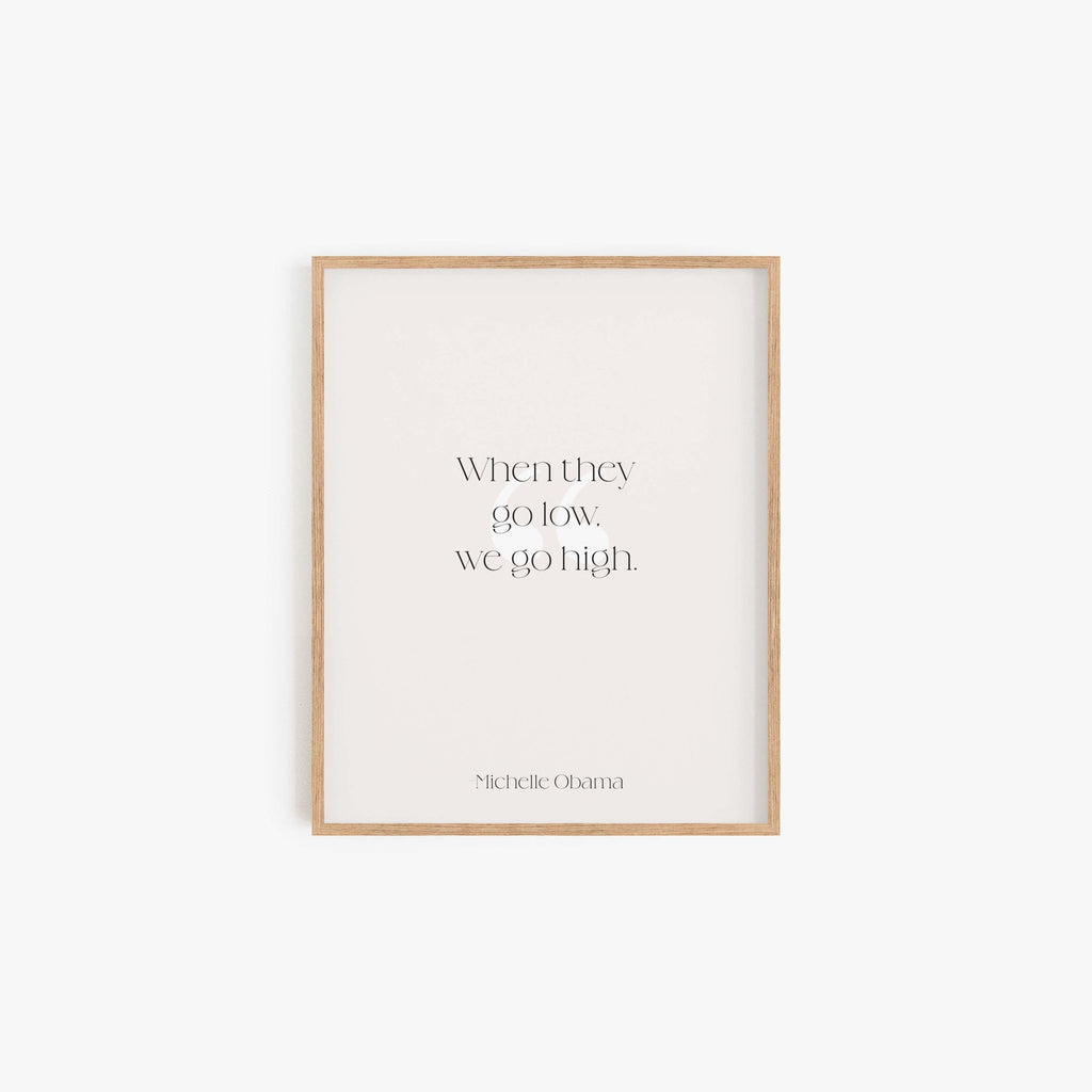 When They Go Low We Go High quote art print in natural wood frame