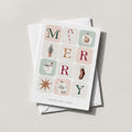 Winter Blocks holiday card spelling MERRY in illustrated winter tiles on a soft neutral background