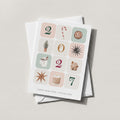 Winter Blocks holiday card spelling PEACE in illustrated winter tiles on a soft neutral background