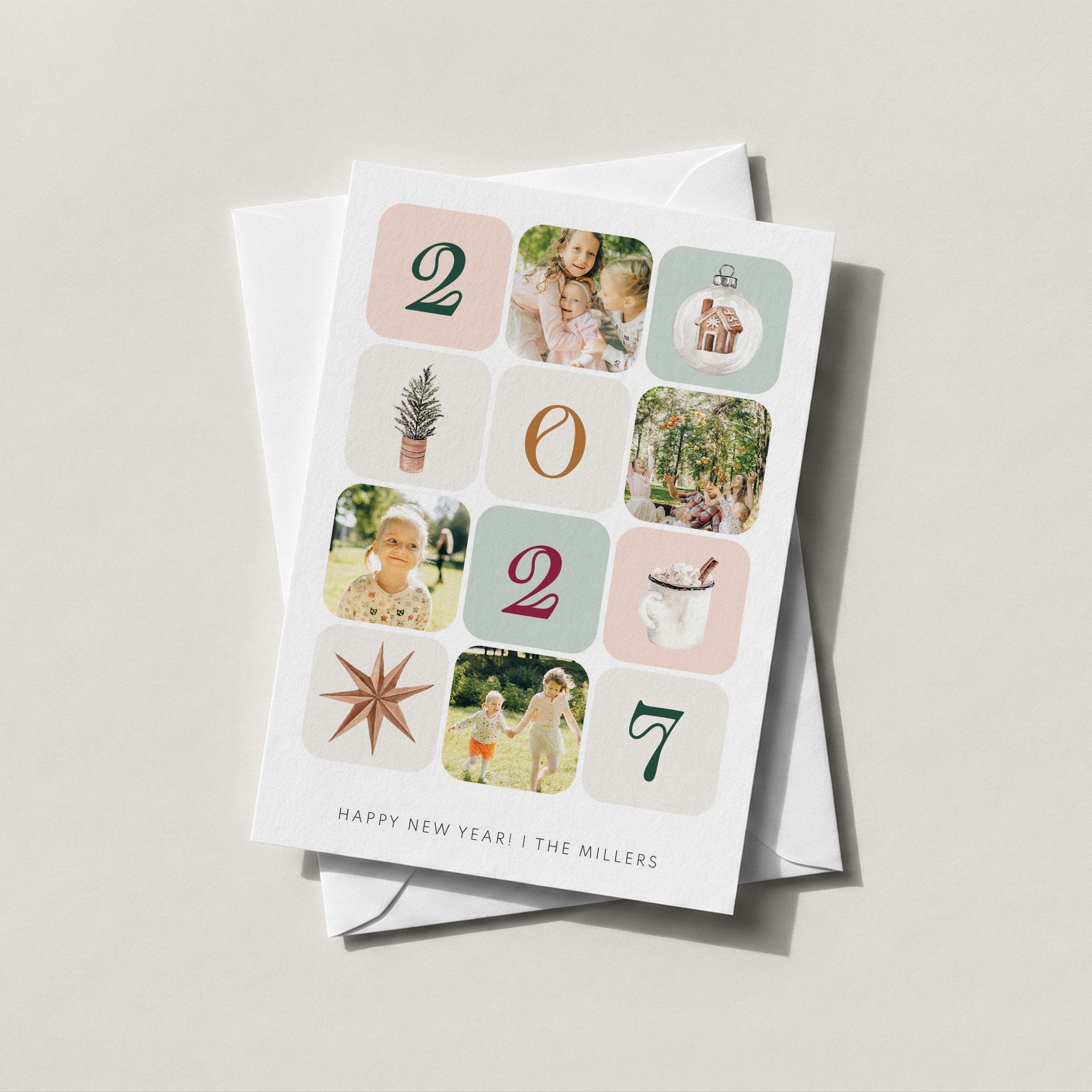 Winter Photo Blocks card mixing four family photos with illustrated winter tiles to spell 2027