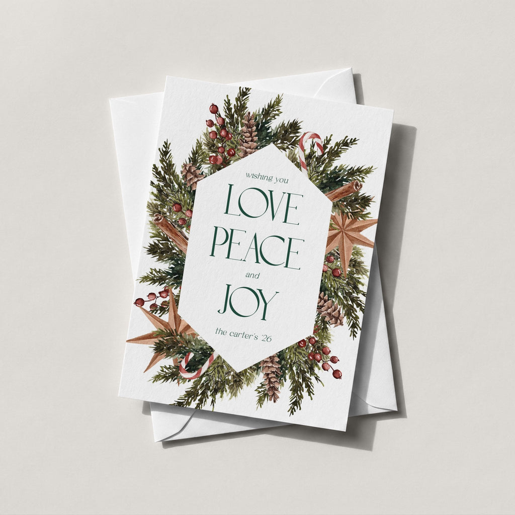 Winter Wreath holiday card with a pine, berry and eucalyptus wreath around LOVE PEACE JOY
