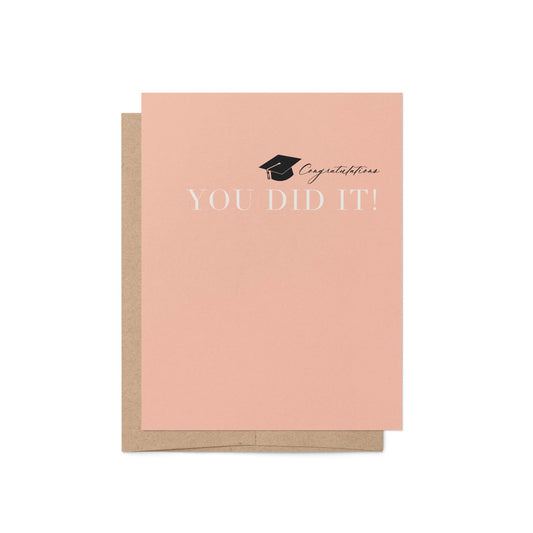 Modern graduation card with peach background and kraft envelope
