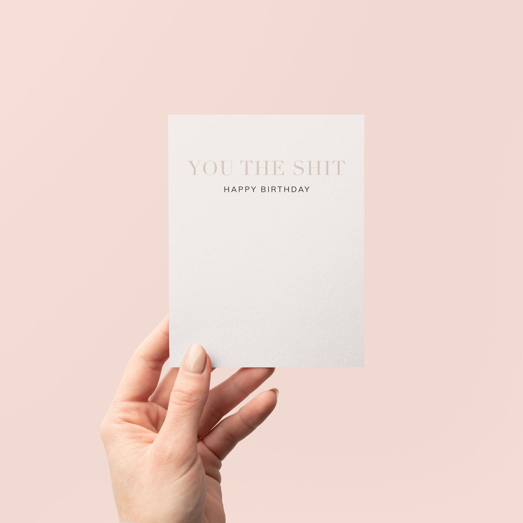You the Shit birthday greeting card by Blú Rose held in hand against a neutral off-white background