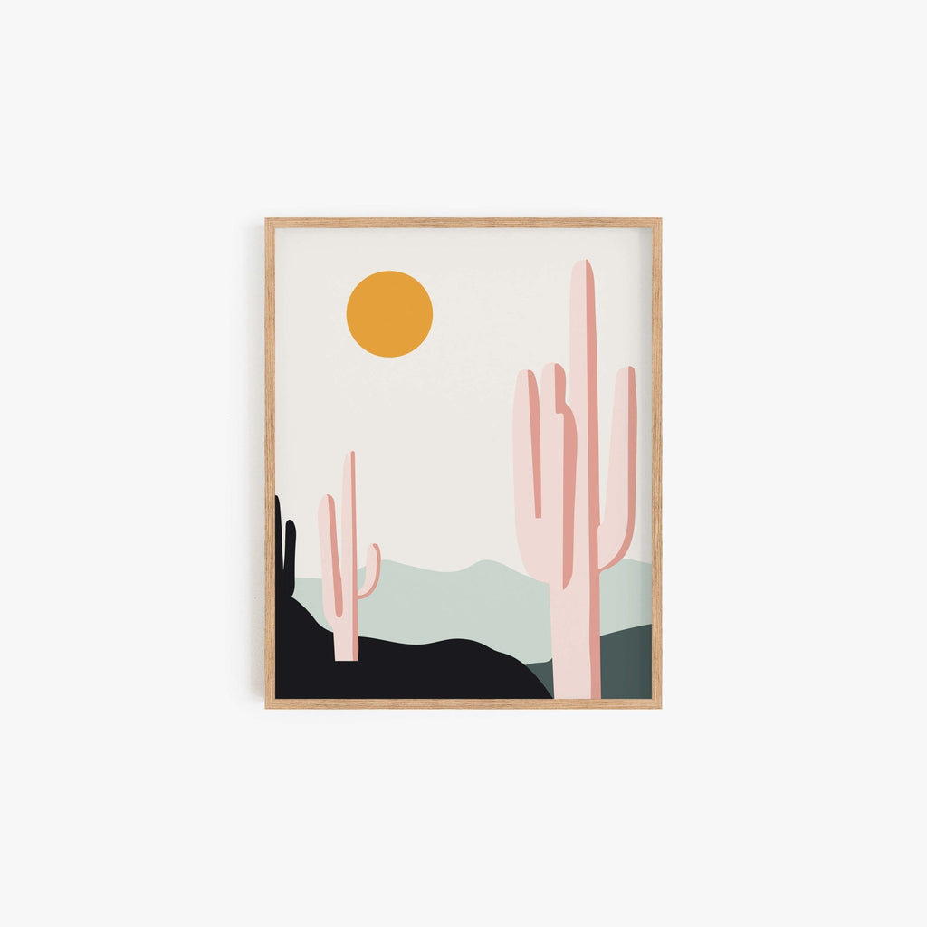 Desert Sunrise Cacti Art Print featuring warm pastel tones, saguaro cactus silhouette, and layered Southwest desert hills in a wood frame