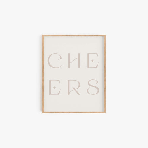 Minimal “CHEERS” typography art print in a neutral beige frame displayed on a white wall.