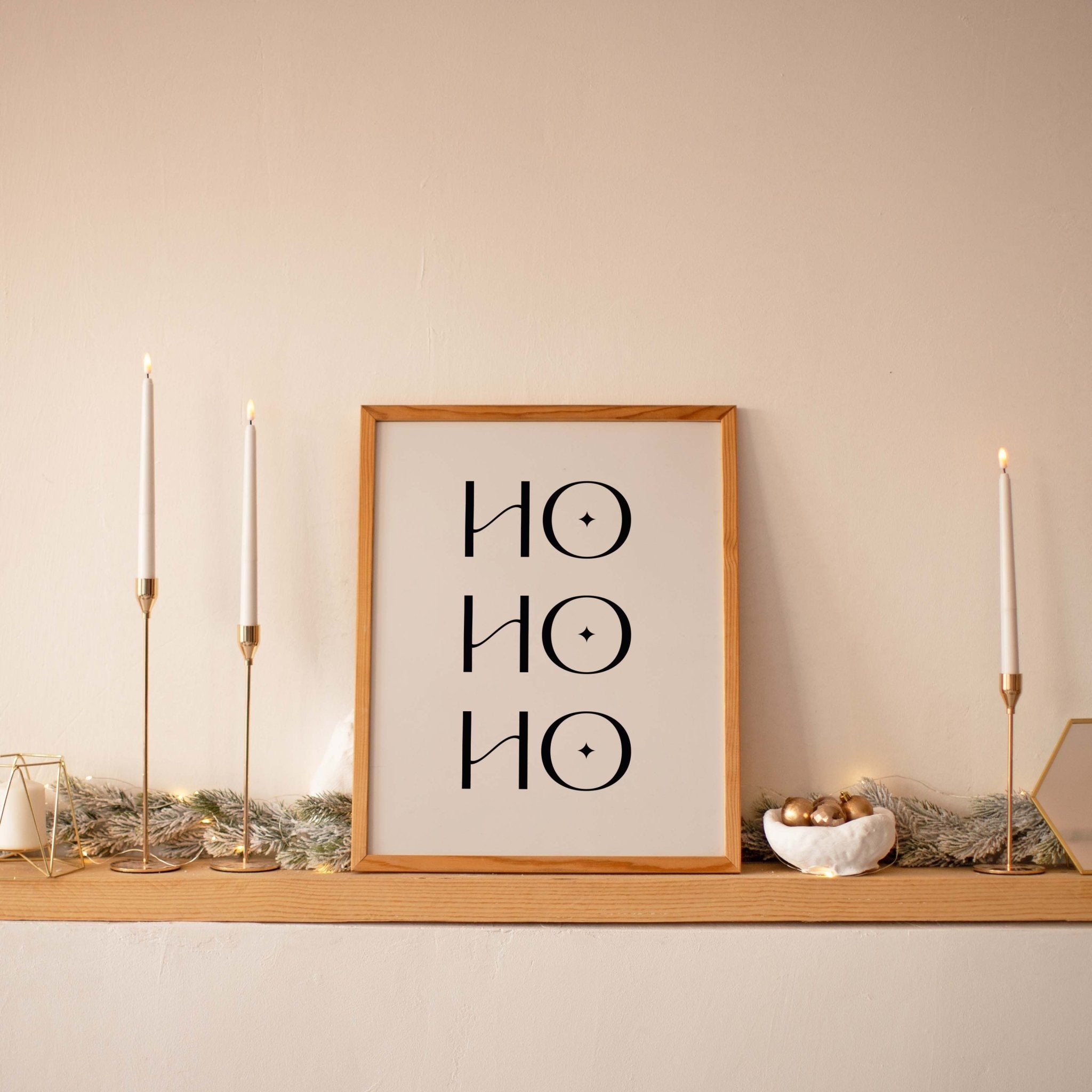 Ho Ho Ho Christmas wall art styled on holiday mantel with candles