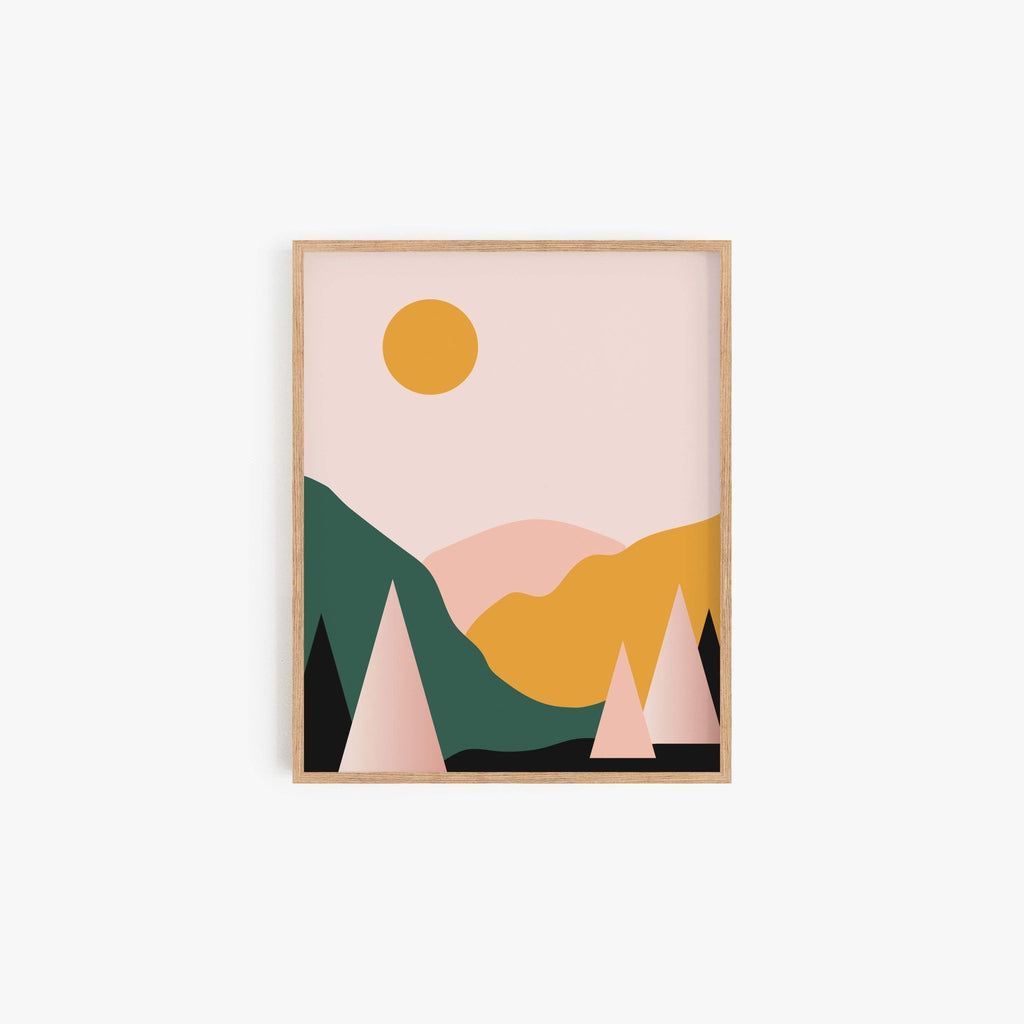 Modern mountain landscape art print with geometric hills, trees, and sun in wood frame