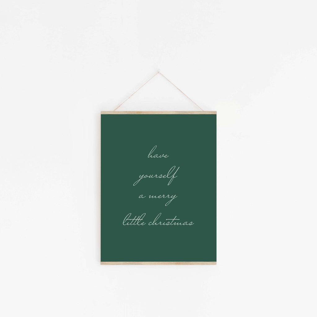 Green Christmas typography wall art hanging from wooden hanger