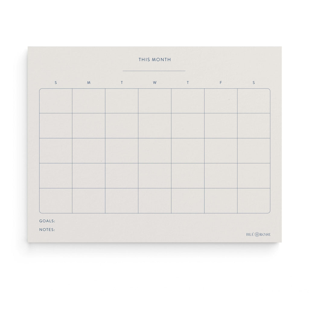 Minimalist Monthly Planner notepad by Blú Rose, undated monthly calendar grid with 'This Month', weekday columns, goals and notes sections in navy