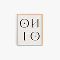 Minimalist Ohio typography art print in black lettering on off-white background in light wood frame