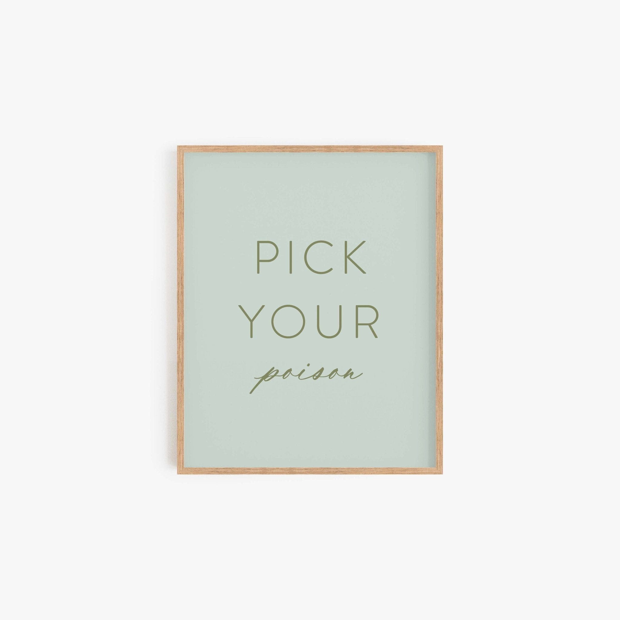 Pick Your Poison typography art print in sage green with minimalist lettering in light wood frame