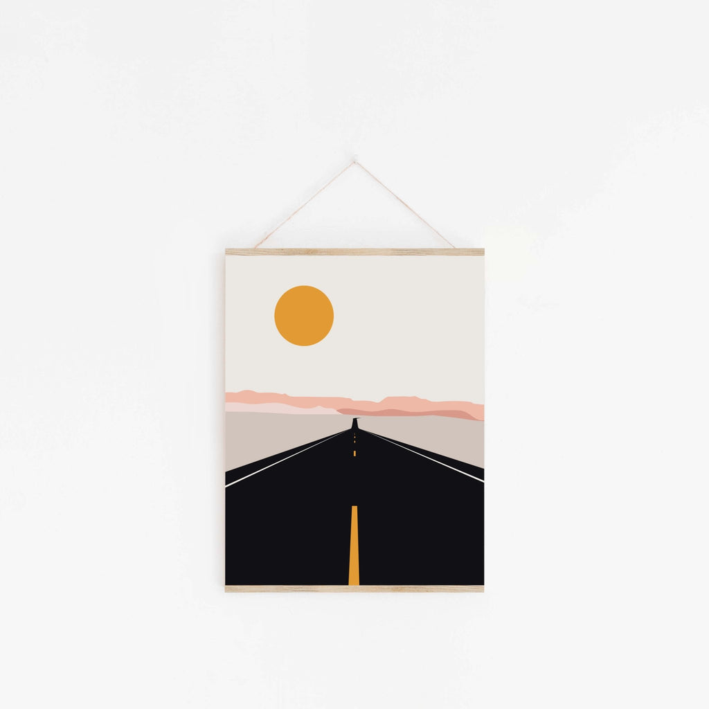 Road trip art print hanging on a wall with a wooden magnetic hanger.
